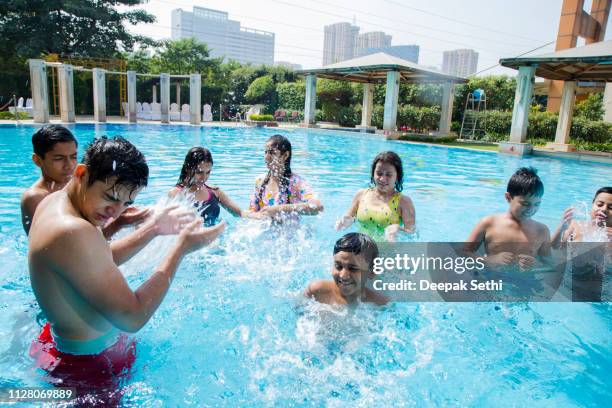 Track Pool Friends 193 Friends In Swimming Pool Looking At Cell Phone Stock Photos, High ...
