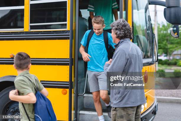 Getting Off Teenager Getting Off Bus Photos and Premium High Res Pictures - Getty ...