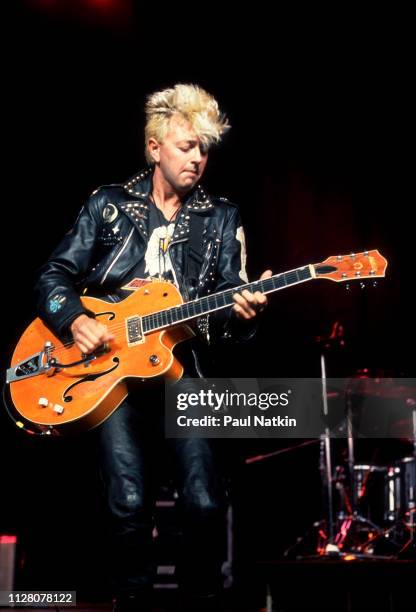 American Rockabilly and Rock musician Brian Setzer, of the group Stray Cats, plays guitar as he performs onstage at the Marcus Amphitheater,...