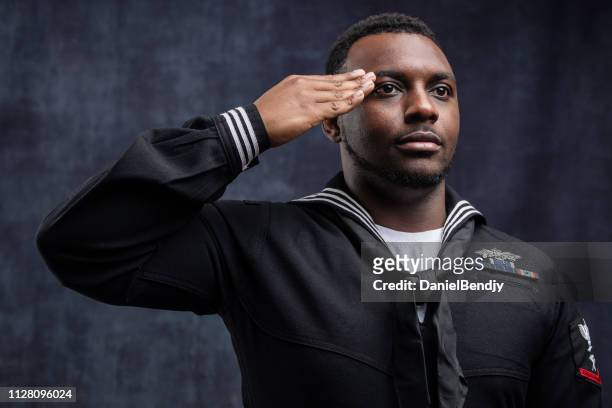 us navy seabee service member - person saluting stock pictures, royalty-free photos & images