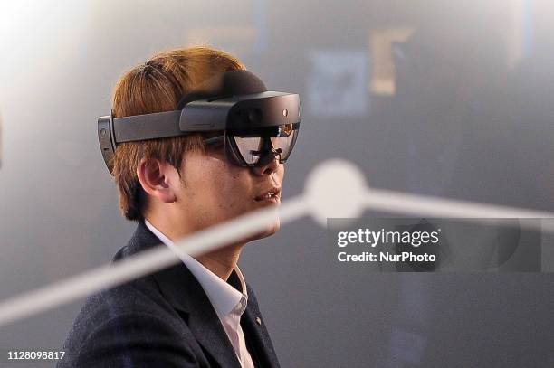 Congressman, experience the augmented reality by HoloLens 2, a AR headset designed by Microsoft, exhibited during the Mobile World Congress, on...