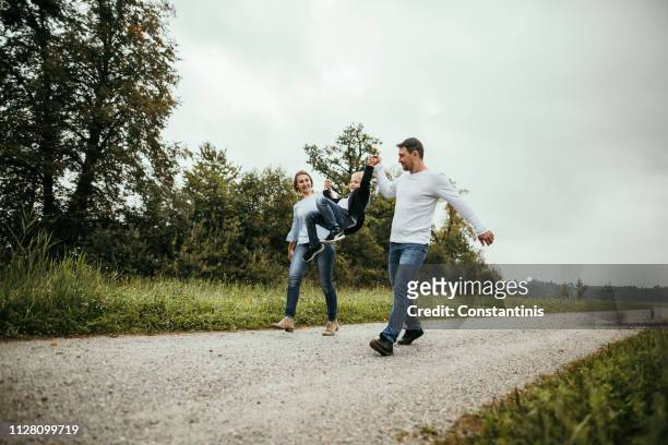 happy family in nature - young family outside stock pictures, royalty-free photos & images