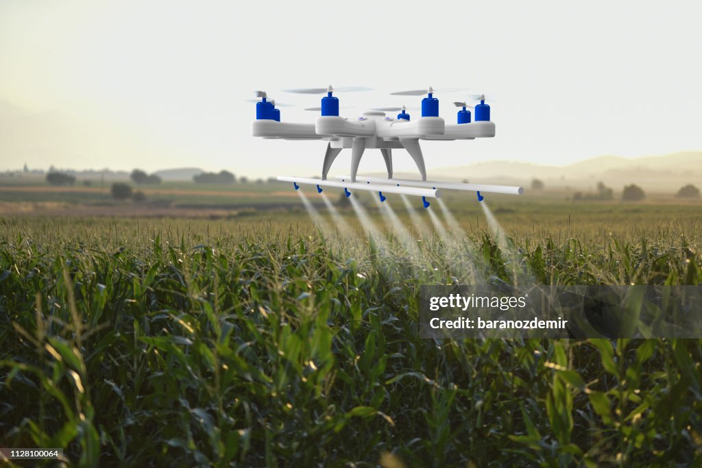 Drone spraying a field