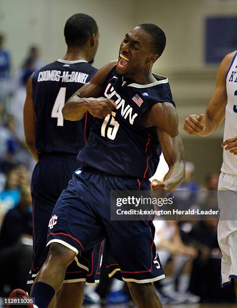 Connecticut's Kemba Walker reacts after hitting a 3-pointer against Kentucky in the first half of the championship game of the Maui Invitational...