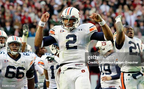 Auburn quarterback Cam Newton helps fire up his team prior to the start of the fourth quarter against Alabama at Bryant-Denny Stadium in Tuscaloosa,...