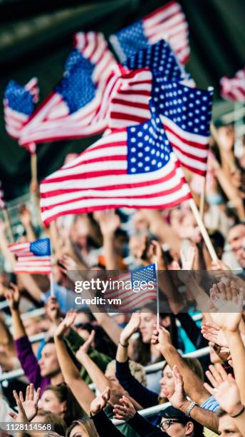 usa flags on a stadium - us flag waving stock pictures, royalty-free photos & images