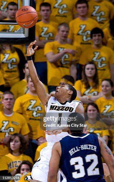 Missouri's Phil Pressey beats Oral Roberts' Damen Bell-Holter for a bucket at Mizzou Arena, in Columbia, Missouri, on Thursday, December 16, 2010....