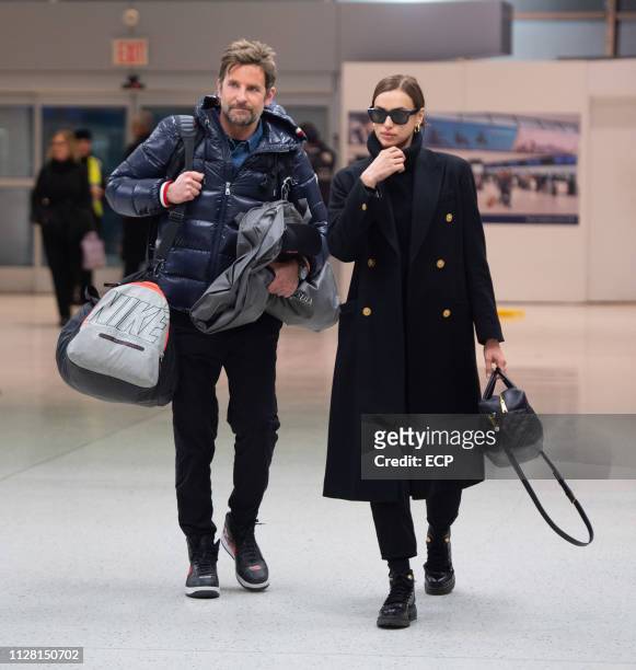 Bradley Cooper and Irina Shayk arrive at JFK airport on February 7, 2019 in New York City.