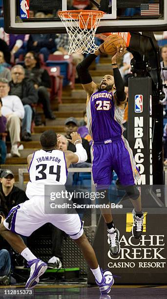 Phoenix Suns shooting guard Vince Carter shoots over Sacramento Kings center Jason Thompson in the first half at Arco Arena in Sacramento,...