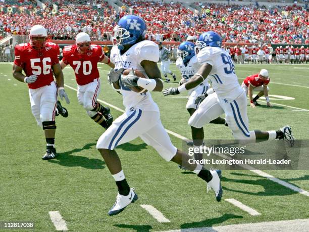 Kentucky's Trevard Lindley runs to the end zone for a third quarter interception against Miami of Ohio. The Wildcats defeated the RedHawks, 42-0 on...