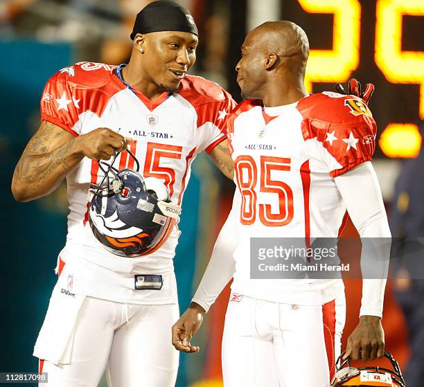 Wide receiver Brandon Marshall talks to teammate AFC wide receiver Chad Ochocinco prior to the third quarter of the 2010 Pro Bowl on Sunday, January...