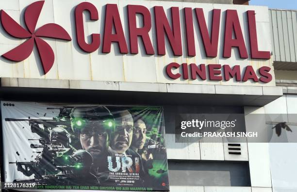 Banner for the Bollywood film "Uri: The Surgical Strike" is pictured on the exterior of a cinema in Ghaziabad on March 1, 2019. - Since the recent...