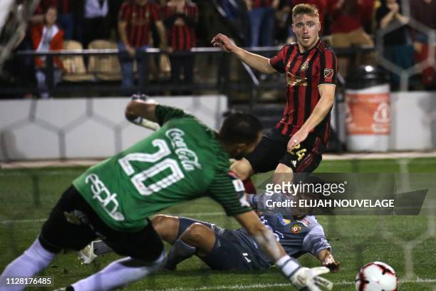 Herediano goalkeeper Daniel Cambronero stops a shot on goal by Atlanta United midfielder Julian Gressel in the second half of the CONCACAF Champions...