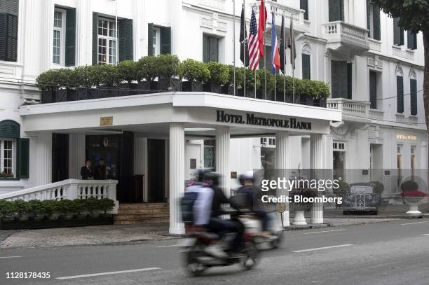 Motorcyclists ride past the Sofitel Legend Metropole Hanoi hotel in Hanoi, Vietnam, on Friday, March 1, 2019. North Korean leader Kim Jong Un vowed...
