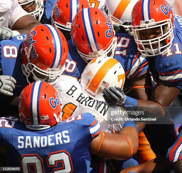Florida defense stops Tennessee running back Bryce Brown during the first half of their game at Ben Hill Griffin Stadium in Gainesville, Florida,...