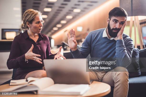 coworkers arguing. - disagreement at work stock pictures, royalty-free photos & images
