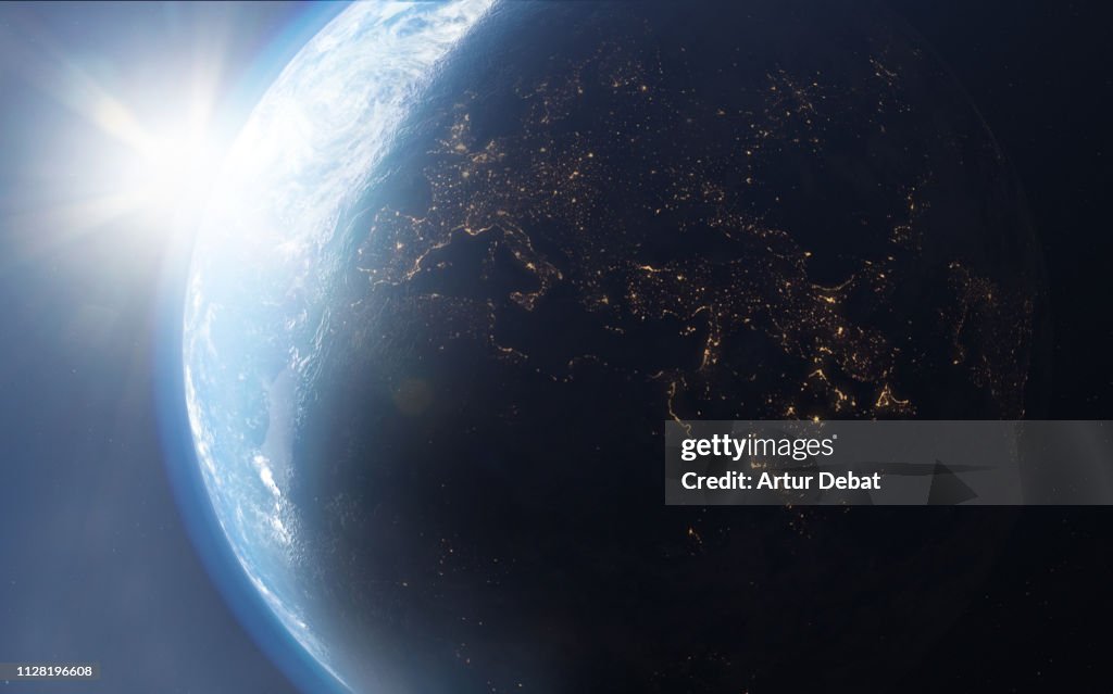 The planet earth taken from the outer space with bright sun.