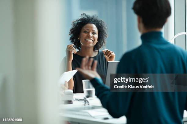 group of co-workers standing around desk and having meeting - asian young executive laughing office bildbanksfoton och bilder