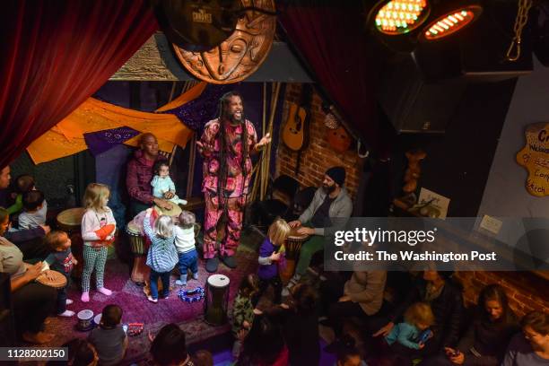 Baba Ras D, the premiere child entertainer in D.C. These days sings to the crowd as he closes a performance at BloomBars on Saturday, November 11 in...