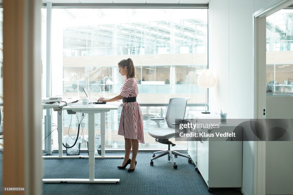 Businesswoman working on computer in office