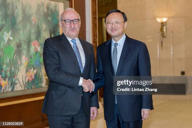 Diplomatic advisors of French President Philippe Etienne shakes hands with Director of the Office of the Foreign Affairs Commission of the CPC...