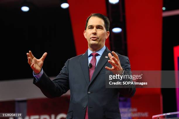 Former Wisconsin Governor Scott Walker seen speaking during the American Conservative Union's Conservative Political Action Conference at the Gaylord...