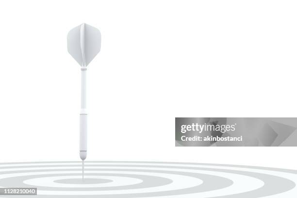 dart im auge des stiers - darts on white stock-fotos und bilder