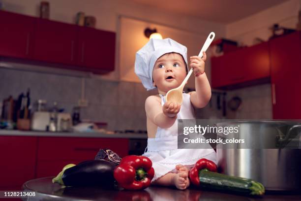 playing in the kitchen - baby chef stock pictures, royalty-free photos & images