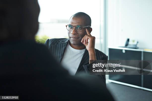 business people in big meeting room - man looking over shoulder stock pictures, royalty-free photos & images