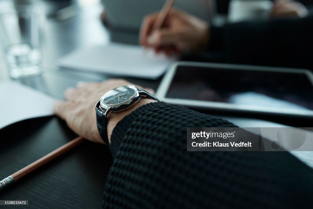 Close-up of businessmans hands and watch