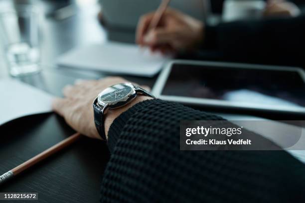 close-up of businessmans hands and watch - only men boardroom stock pictures, royalty-free photos & images