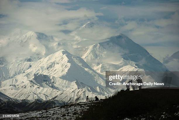 Mount McKinley forms the backdrop for photographers in Denali National Park in 2006.