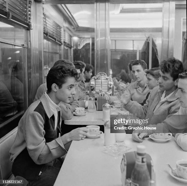 American actor Sal Mineo with his friends at a diner, New York City, US, 11th January 1955.