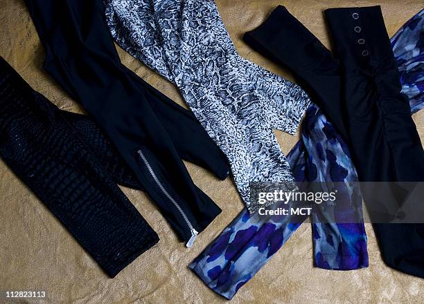 From left, Xhilaration black snakeskin shiny leggings, $12.99, at News  Photo - Getty Images