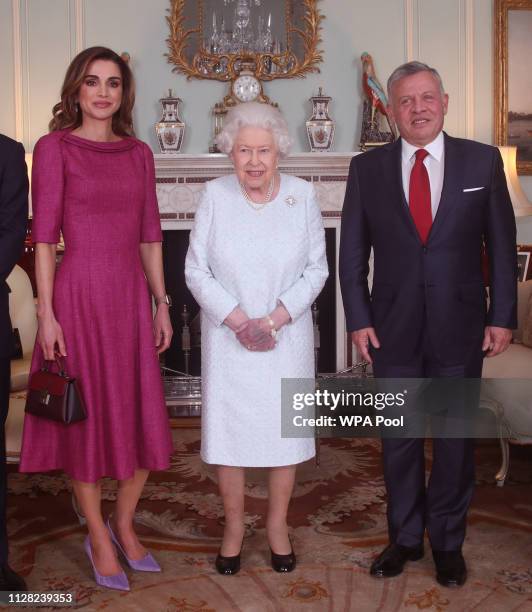 Queen Rania of Jordan, Queen Elizabeth II and King Abdullah II of Jordan during a private audience at Buckingham Palace on January 1, 2019 in London,...