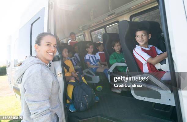 soccer mom transporting kids to summer camp in a van - soccer mom stock pictures, royalty-free photos & images