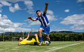 Soccer player making a foul on the field