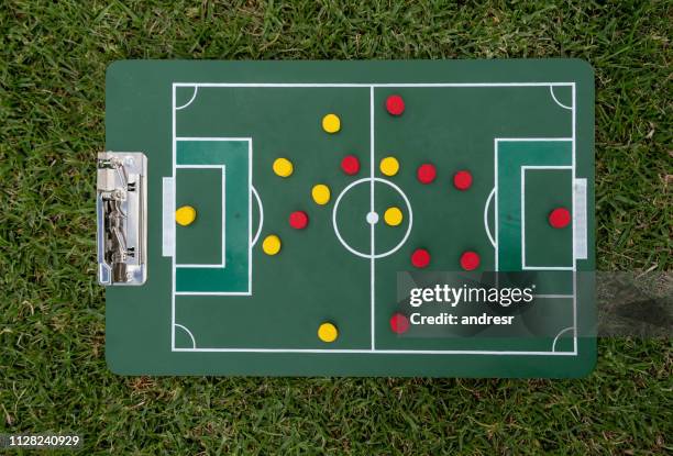 close-up on a strategy board with the line up at a football field - football strategy stock pictures, royalty-free photos & images