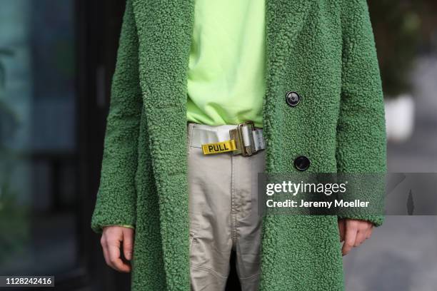 Erik Scholz wearing Zara coat, Gstar cargo pants, Vans shoes, Pull and Bear sweater, Heron Preston belt and a Marc Jacobs glasses on February 08,...