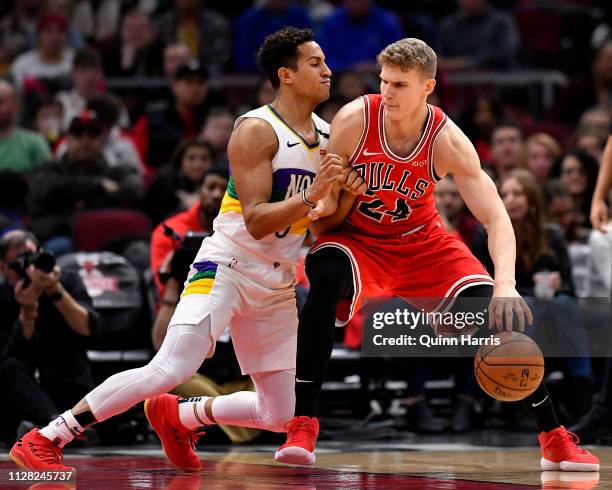 Lauri Markkanen of the Chicago Bulls drives against Frank Jackson of the New Orleans Pelicans at United Center on February 06, 2019 in Chicago,...