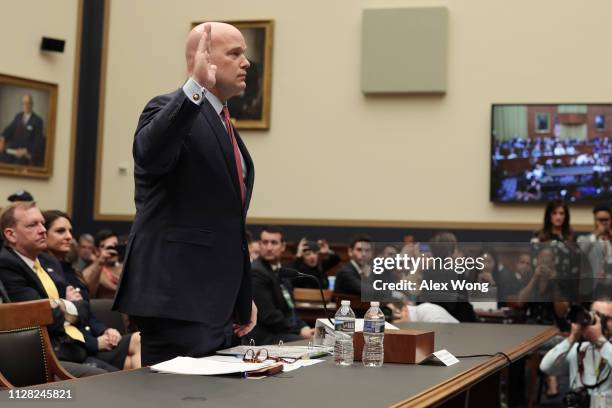 Acting U.S. Attorney General Matthew Whitaker is sworn in before testifying to the House Judiciary Committee in the Rayburn House Office Building on...