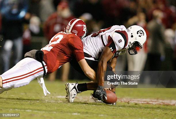 South Carolina junior defensive end Cliff Matthews recovers a fumble in front of Alabama quarterback Greg McElroy in the second quarter at...