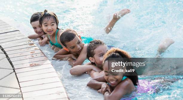 Splashing Pool Children Having Fun Kicking Splashing In Swimming Pool High-Res Stock ...