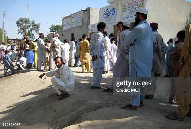 Refugees from South Waziristan wait to register as displaced people in Dera Ismail Khan, Pakistan