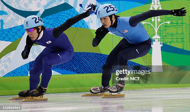 Korea's Lee Ho-Suk leads USA's Simon Cho in the Men's 500 Meter qualifying heats during the 2010 Winter Olympics in Vancouver, British Columbia,...