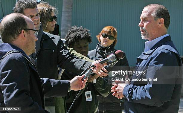 Chuck Tompkins, right, corporate curator Zoological Operations at all SeaWorld Parks, talks to the media Thursday, February 25 a day after Dawn...