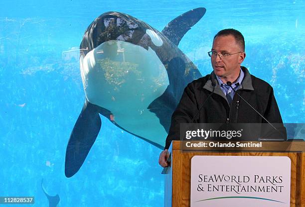 Jim Atchison, president and CEO SeaWorld Parks & Entertainment, speaks during a news conference Friday, February 26 with a killer whale behind...