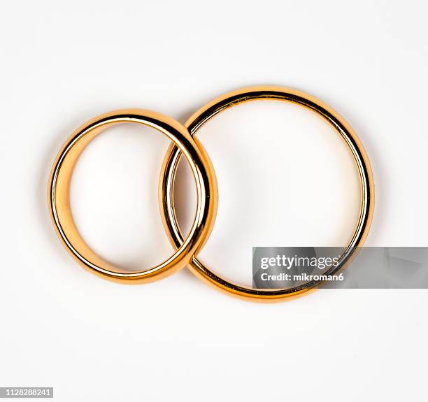 close-up of wedding rings - open round two stock pictures, royalty-free photos & images