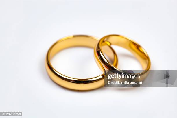 close-up of wedding rings - open round two stock pictures, royalty-free photos & images