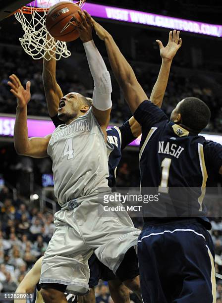 Notre Dame forward Tyrone Nash blocks a shot by Georgetown guard Chris Wright during second-half action at the Verizon Center in Washington, D.C.,...